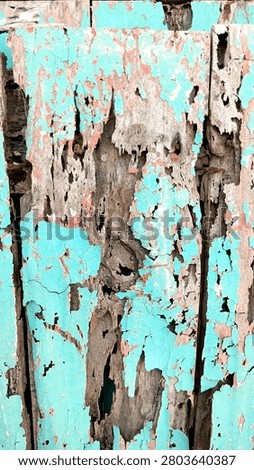 This texture features a weathered wood surface with peeling and cracked light blue paint.