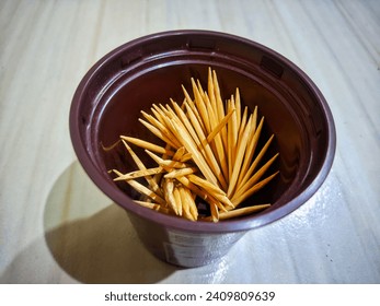 this is a toothpick. usually used to remove food stuck between the teeth.