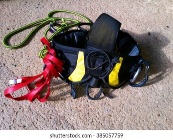 This Is A Tree Climbing Harness. Attached To It Is A Kernmantle Type Lifeline In Green. Also A Flat Rope In Red Which Tree Climber Used It To Climb On Palm Tree For Pruning Works.