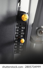 This type of selectorized equipment is highly valued for its user-friendly interface. By simply moving the selector pin to a different plate, a user can instantly change the amount of resistance without the need to manually add or remove loose weight plates. The clear, legible numbering system minimizes the time required to adjust the machine between sets, promoting a continuous and efficient workout flow. The inclusion of the incremental adjustment knob at the top further enhances the machine's versatility, enabling users to make marginal adjustments to their workload, which is particularly beneficial for rehabilitation or advanced hypertrophy training.