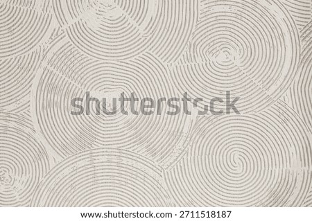 This unique design features a repeating pattern of swirling, textured circles in a soft, neutral color palette