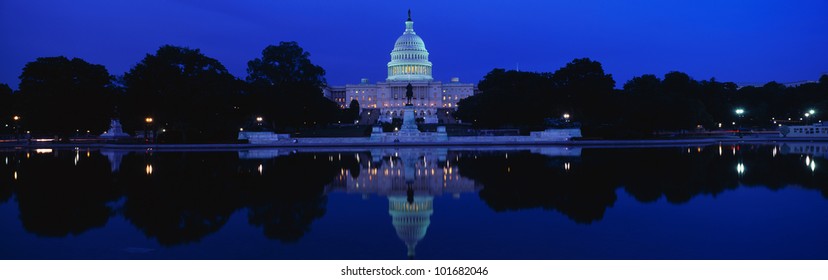 This is the U.S. Capitol set in front of the Capitol reflecting pool at sunset.