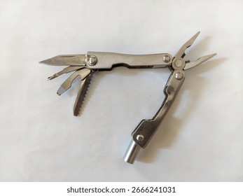This versatile multi-tool combines pliers, a knife, and a screwdriver in one compact design. Made from durable stainless steel, it's perfect for camping, DIY, and everyday carry.