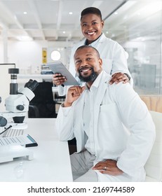 This Is A Very Intricate Process To Follow. Shot Of Two Scientists Using Microscopes In A Lab.