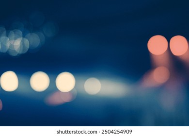 This vibrant image showcases an abstract view of a lively event or concert, with a beautiful bokeh effect highlighting the red and yellow lights against a blurred backdrop. 