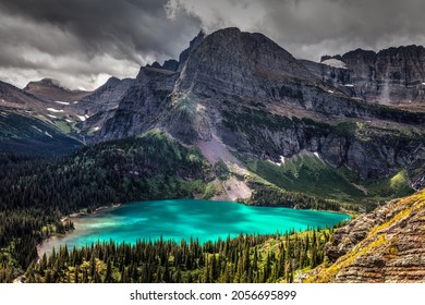 This Is A View Of One Of The 3 Grinnell Lakes And Surrounding Mountains, Taken From The Grinnell Glacier Trail In The Many Glacier Area Of Glacier National Park In Montana.