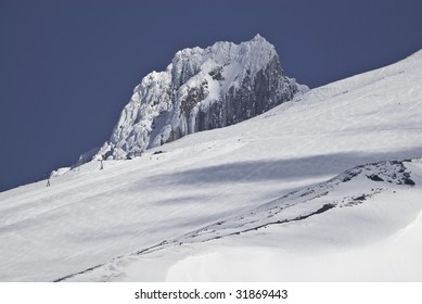 This is a view from a rest stop of highway 26.You can see a couple of people skiing down the mountain.