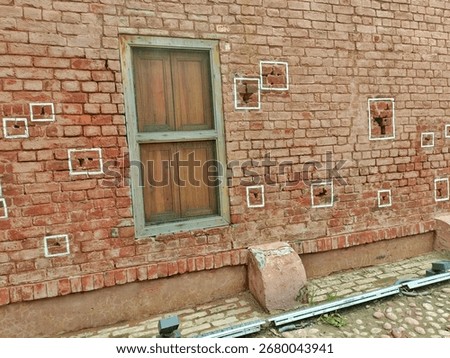 This is a wall inside Jallianwala Bagh, Amritsar.
The bullet marks from the 1919 massacre are still preserved and highlighted with white squares, serving as a memorial to the tragic event.

