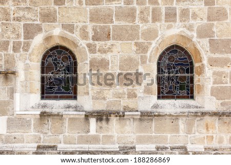 this wall and window of a church from the neighbor