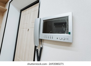 This wallmounted intercom system features a userfriendly screen and simple controls, enhancing communication in modern homes while providing convenience and efficiency for everyday use