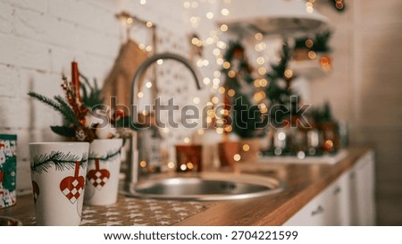 This warm and inviting kitchen scene captures the essence of the holiday season with its charming details and soft lighting