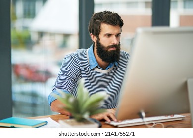 This Is What The New Age Of Business Looks Like. Cropped Shot Of A Creative Businessman Working On His Computer In The Office.