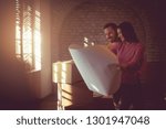  This will be the perfect beginning of our lives. Couple in new house taking plan of house. Copy space.