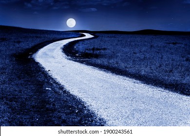 This Winding Country Road In The Tallgrass Prairie Of Kansas Glows In The Moonlight Of A Full Moon, A Photo Illustration That Makes You Feel Like You Can Drive To The Moon. 