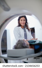 This Wont Hurt A Bit. Shot Of A Mature Woman Being Comforted By A Doctor Before And MRI Scan.