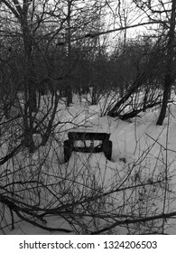 This would work well as an album cover. Darker scene, abandoned, falling a part chair, in the wintery forest. Sun peeks through. Shows public property and was taken on public property. Feb 2019 in ON 
