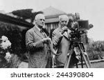 Thomas Edison 1847-1931 and George Eastman 1854-1932 standing with motion picture camera ca. 1925.