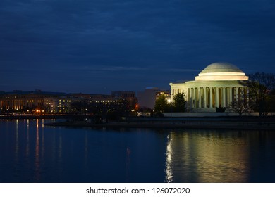 Thomas Jefferson Memorial Silhouette At Sunrise With Mirror Reflection On Water, Washington DC United States