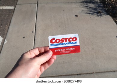 Thornton, CO USA - December 4, 2021: A Hand Holding A Costco Wholesale Business Member Card Outside On A Sunny Day