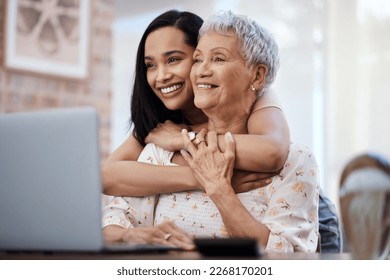 Its those little moments in life. Shot of a senior woman using a laptop with her daughter at home. - Powered by Shutterstock