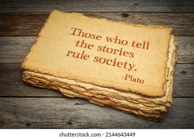 Those who tell the stories rule society, Plato, ancient Greek philosopher, quote. Inspirational handwriting on handmade paper against rustic weathered wood, storytelling and narration concept.