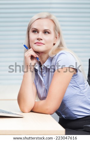 Thoughtful and beautiful woman at work