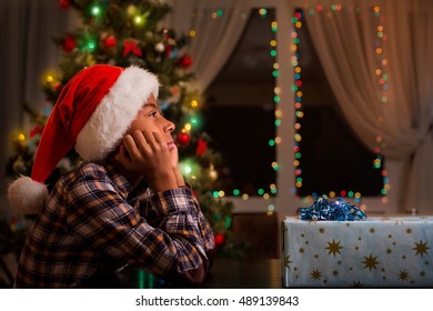 Thoughtful Black Boy On Christmas. Sad Afro Kid On Christmas. Too Sad For Celebration. Cheer Up My Friend.