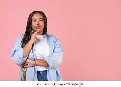 Thoughtful Black Obese Woman Thinking Posing Looking Aside At Empty Space For Text Standing On Pink Background. Let Me Think About It Concept. Studio Shot - Powered by Shutterstock