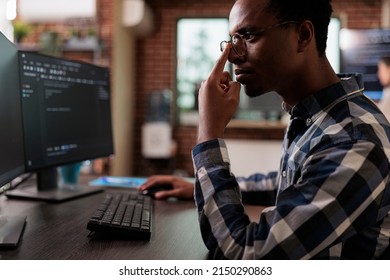 Thoughtful blockchain developer reflecting at low levels of security and how to improve mainframe defence system. Pensive network engineer thinking of failed data processing operation.