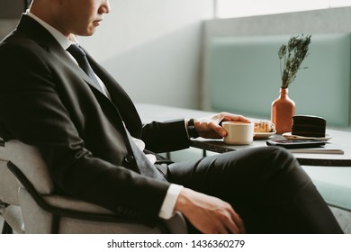 Thoughtful Business Man Drinking Coffee In A Modern Cafe,  Coffee Break Tea Time Relaxation Concept.