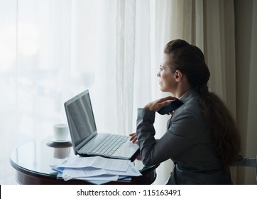 Thoughtful Business Woman Working At Hotel Room