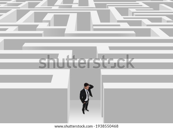 Thoughtful\
businessman trying to find way out of\
maze
