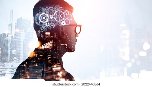 Thoughtful businessman wearing formal suit and glasses is thinking and pondering about new creative ideas. City skyscraper downtown in the background. Concept of modern technology and inspiration - Powered by Shutterstock