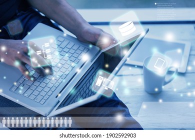 Thoughtful businessman working in an office with double exposure of global infographics interface. - Shutterstock ID 1902592903