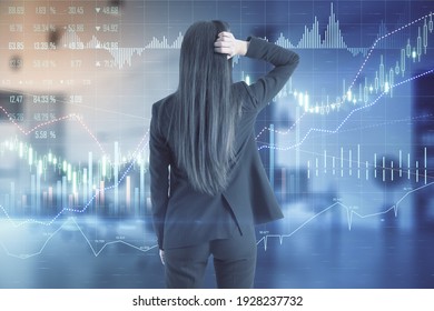 Thoughtful businesswoman back analysing stock market chart screen with financial chart, graphs and diagram. Double exposure - Powered by Shutterstock