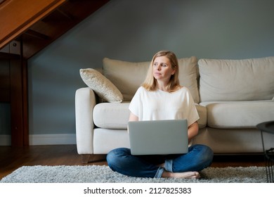 Thoughtful Cute Woman In Casual Wear Sitting With Computer On Sofa, Can't Focus On Work, Needs Rest, Feeling Bored, Need Extra Motivation, Working Remotely At Home