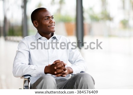 thoughtful disabled man in wheelchair looking way