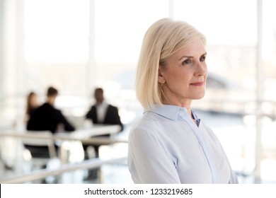 Thoughtful Dreamy Middle Aged Businesswoman Looking Away Thinking Of New Goals Opportunities In Office, Serious Mature Senior Old Woman Planning Future, Dreaming Of Success, Business Vision Concept