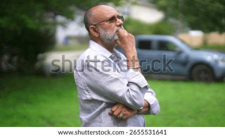 Thoughtful expression. Old, bald, bearded handsome male.