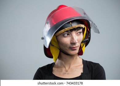 Thoughtful female architect wearing helmet against white background - Shutterstock ID 743433178