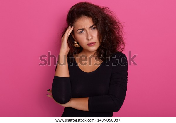 Thoughtful Female Having Dark Wavy Hair Stock Photo Edit Now