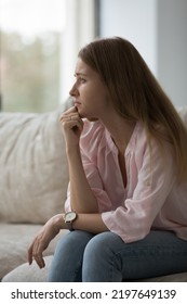 Thoughtful Frustrated Concerned 30s Woman Thinking Over Problems, Failure At Home, Touching Chin, Looking Away, Feeling Anxious, Stressed, Depressed About Loss, Grief. Emotional Crisis