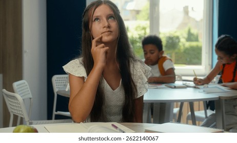 Thoughtful girl kid child daughter schoolgirl pupil teen student learner pensive think learning task homework lesson studying in classroom school education library academy thinking dreaming imagine
