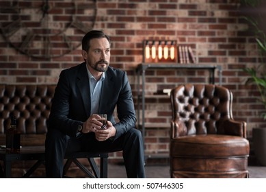 Thoughtful Handsome Man Drinking Whisky