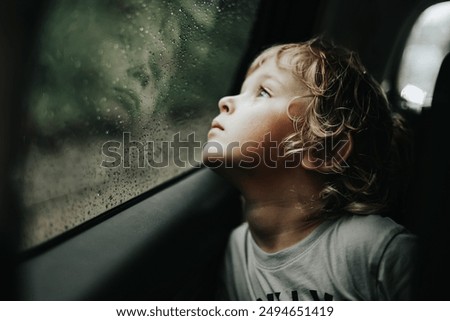 Similar – Image, Stock Photo Blond little child is traveling with family by ferry or ship. Schoolboy is admiring the landscape of the Adriatic Sea. Cruise during the holidays.