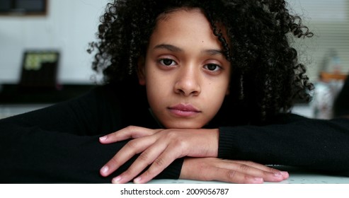 Thoughtful little girl thinking. Mixed race child face close-up