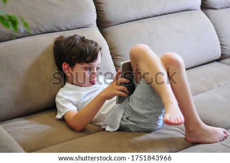 Similar – Little boy using a tablet