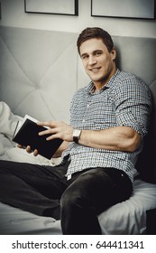 Thoughtful man with a note in his bed.