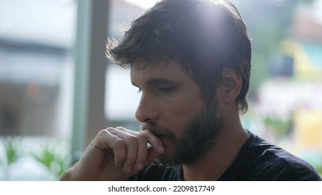 Thoughtful Man Thinking Solution. One Pensive Person Pondering Solving Hard Problem. Individual Trying To Remember Memory Seated At Coffee Shop