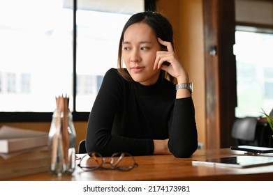 Thoughtful Millennial Asian Female College Student Or Freelancer Pensive Thinking Some Ideas For Her Project.